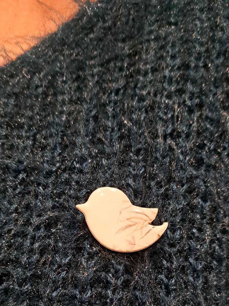 Broche oiseau poète